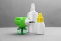 Set of different insect repellents on grey background Royalty Free Stock Photo