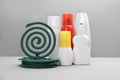 Set of different insect repellents on grey background Royalty Free Stock Photo