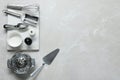 Set of different kitchen utensils on grey marble table, flat lay. Space for text Royalty Free Stock Photo