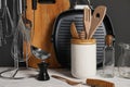 Set of different kitchen utensils on white wooden table against grey background Royalty Free Stock Photo