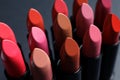 Set of different lipsticks on grey background, closeup. Royalty Free Stock Photo