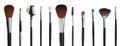 Set with different makeup brushes for applying cosmetic products on white background. Banner design Royalty Free Stock Photo