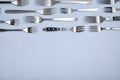 Set of different metal forks on white background