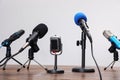 Set of different microphones on table. Journalist`s equipment