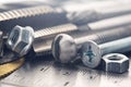 Set of different nuts, bolts, screws, washers and drill bits,thread tap and mill cutters on steel plate background. Locksmithing Royalty Free Stock Photo