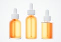 Set of different orange cosmetic serum dropper bottles, skin care product packaging concept, commercial design deady