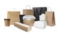 Set with different paper bags, containers for food and takeaway cups white background Royalty Free Stock Photo