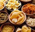 Set of different pasta in the bowls on a dark background Royalty Free Stock Photo