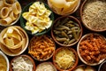 Set of different pasta in the bowls on a dark background Royalty Free Stock Photo