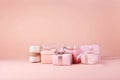 Set of different present boxes with silk ribbons bow on paslet pink background. Gift or holiday concept. Mothers Day, birthday, Royalty Free Stock Photo