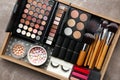 Set of different professional makeup products in box on table Royalty Free Stock Photo