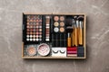 Set of different professional makeup products in box on table Royalty Free Stock Photo