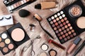 Set of different professional makeup products on furry plaid Royalty Free Stock Photo