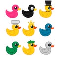 Set of different rubber ducks isolated on a white background. Pink black gray blue green duck duck in a crown with a hat Royalty Free Stock Photo