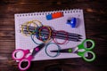 Set of different school stationeries. Notepad, scissors, pensils, on wooden desk. Back to school. Top view Royalty Free Stock Photo