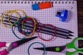 Set of different school stationeries. Notepad, scissors, pensils, on wooden desk. Back to school. Top view Royalty Free Stock Photo