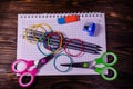 Set of different school stationeries. Notepad, scissors, pensils, on wooden desk. Back to school. Top view Royalty Free Stock Photo