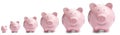 Set with different sized piggy banks Royalty Free Stock Photo