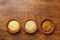 Set of different spices. French mustard, dijon mustard and powder on wooden rustic table top view.