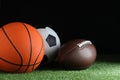 Set of different sport balls on green grass Royalty Free Stock Photo