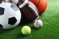 Set of different sport balls on green grass Royalty Free Stock Photo