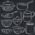 Set of different tableware on blackboard Royalty Free Stock Photo