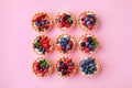 Set of different tartlets or cake with cream cheese, honey and summer berry. Pastry dessert top view. Flat lay