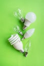 A set of different types of LED lamps isolated on a green background. Energy-saving lamps Royalty Free Stock Photo