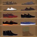Set different types of mens pair shoes and boots on the shelves. Men`s couples of shoes on the rack of the store.