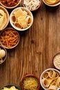 Set of different types of pasta in a bowls on a wooden background