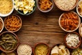 Set of different types of pasta in a bowls on a wooden background Royalty Free Stock Photo