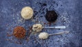 Set of different types rice on grey background: white glutinous, black, basmati, brown and mixed rice. Healthy concept. Top view. Royalty Free Stock Photo