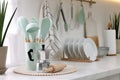 Set of different utensils and dishes on countertop in kitchen Royalty Free Stock Photo