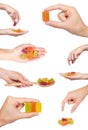 set of different Various color of fruity gummy jelly candies with hand, isolated on white background