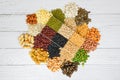 Set of different whole grains beans and legumes seeds lentils and nuts colorful snack background top view - Collage various beans