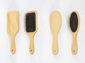 Set of different wooden hairbrushes isolated on white background front back view