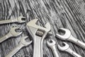 Set of different wrenches on a black wooden table. Royalty Free Stock Photo