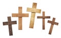 Set of differt size wooden crosses on white background