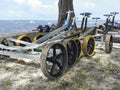 Set of dinghy sailing carts on the beach near the sea and unfocused background. Boat trailers. Beach carts background