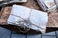 Set of dirty dusty old antique letters, tied with cord and loop. Grunge mail envelope or letter with wax seal