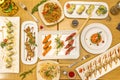 set of dishes of chinese food and sushi. salmon and avocado tartare, yakitori chicken skewers, butterfish nigiri, salmon and red Royalty Free Stock Photo