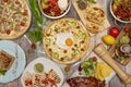 set of dishes from different cultures..BBQ ribs, Mexican quesadillas, hamburgers, Pizzas, nachos with guacamol Royalty Free Stock Photo