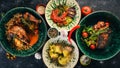 A set of dishes of meat and fresh vegetables and fish on a wooden table. Royalty Free Stock Photo