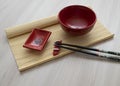 A set of dishes for sushi in red color