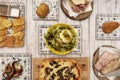 Set of dishes of typical Italian cuisine with a burrata salad with nuts, focaccia, Sicilian mortadella sandwiches and grilled