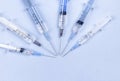 Disposable syringes on blue background Royalty Free Stock Photo