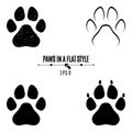 A set of dog`s paws. Black traces in different styles. Isolated on white background. Silhouettes of paws Royalty Free Stock Photo