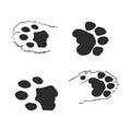 A set of dog`s paws. Black traces in different styles. Isolated on white background. Silhouettes of paws. Vector illustration. ca Royalty Free Stock Photo