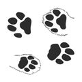 A set of dog`s paws. Black traces in different styles. Isolated on white background. Silhouettes of paws. Vector illustration. ca Royalty Free Stock Photo