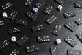 A set of domino bones,dices on black stone background